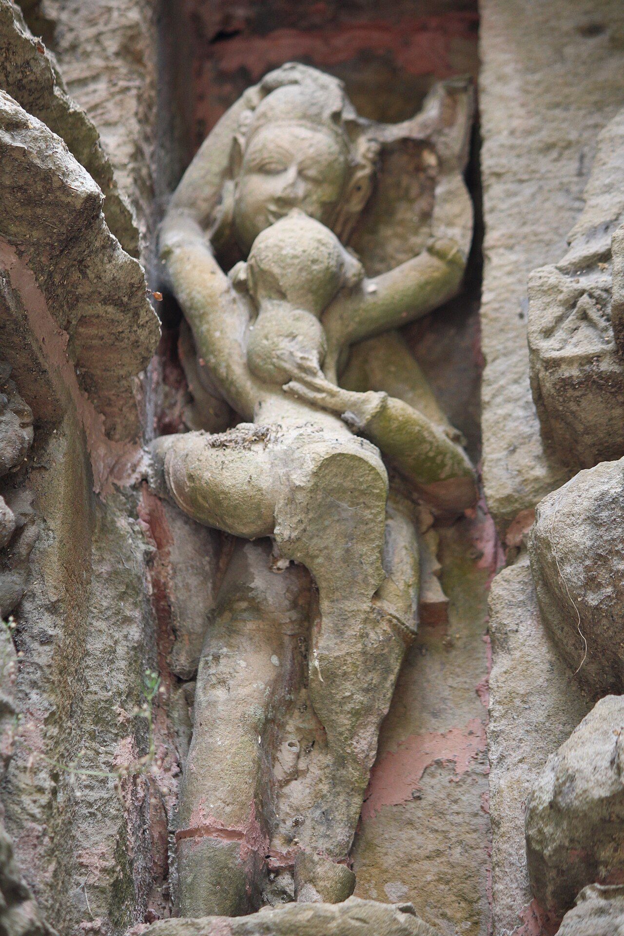 An amorous couple carved in stone on the wall of a Hindu temple