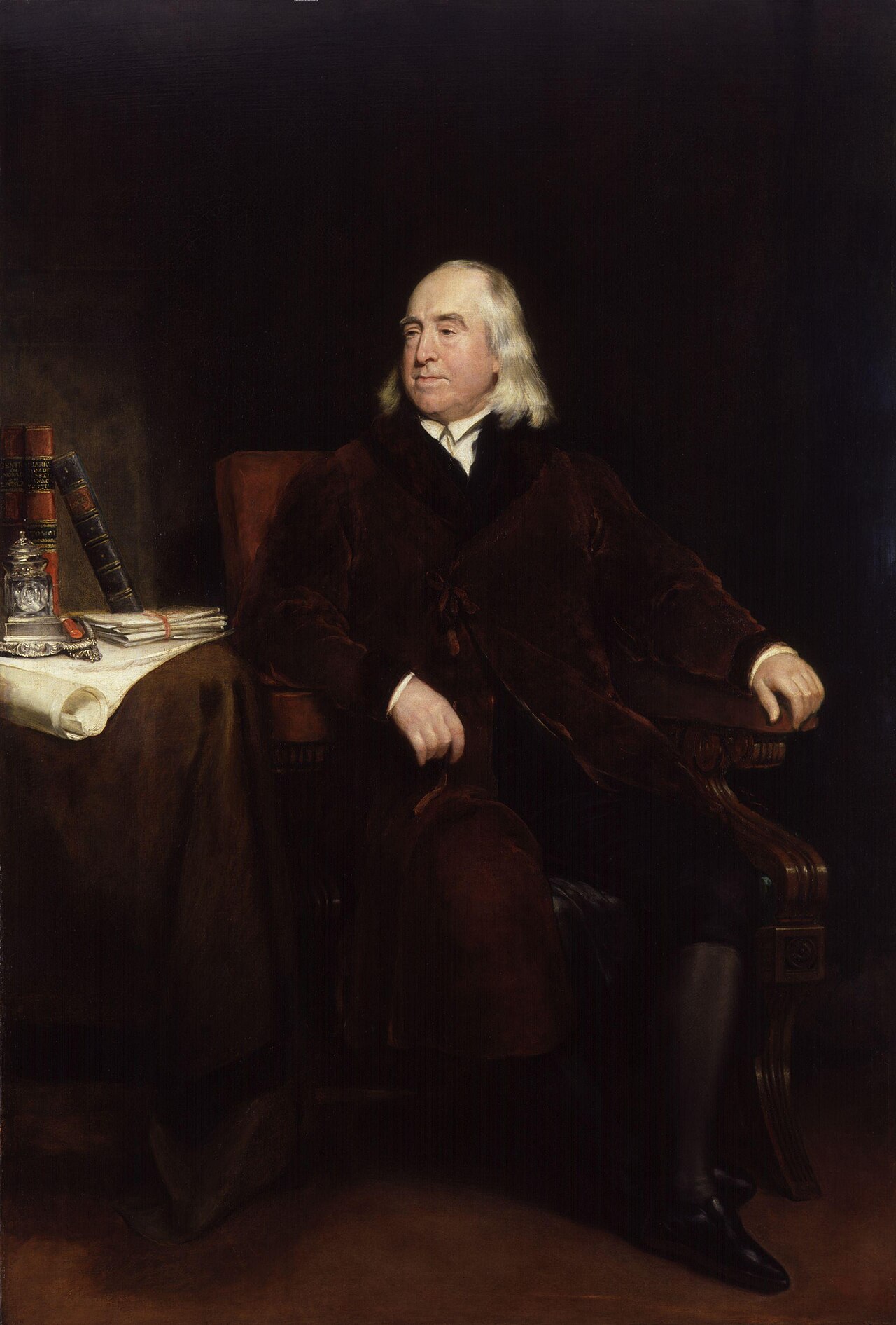 Portrait of Jeremy Bentham, English philosopher and legal reformer, seated with quill and papers