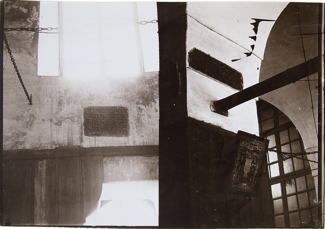 Anthropologist's field notebook and camera on a wooden table, symbolising ethnographic fieldwork