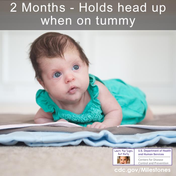 A young infant looking alertly toward the camera