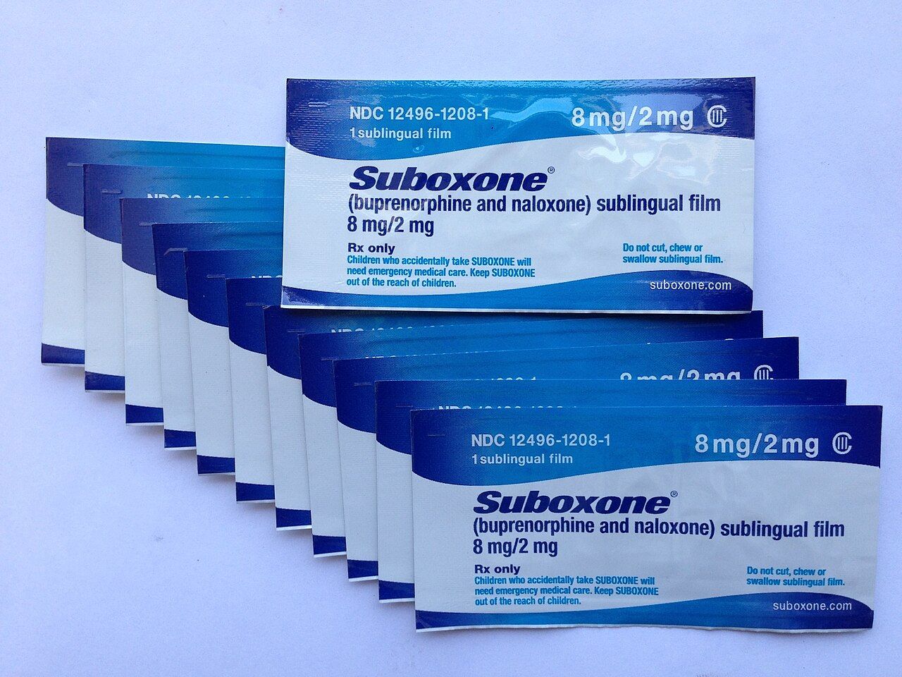 Buprenorphine, a high-affinity partial mu agonist with a ceiling on respiratory depression, roughly halves all-cause mortality in opioid use disorder.