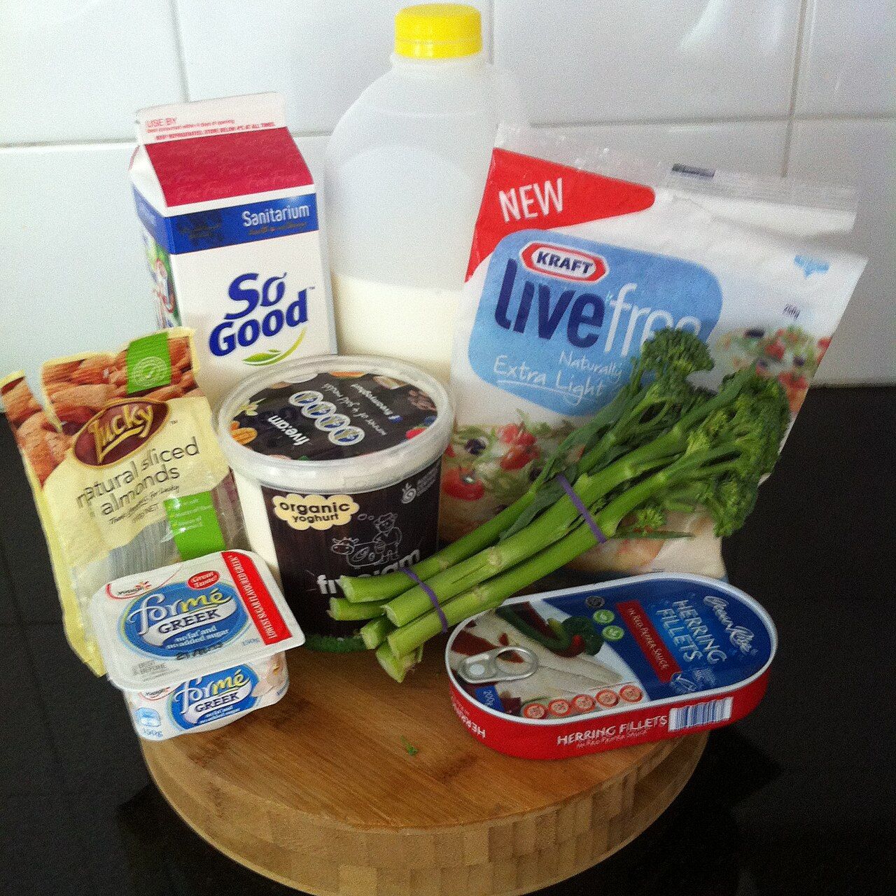 An assortment of calcium-rich foods including dairy, greens, and fish