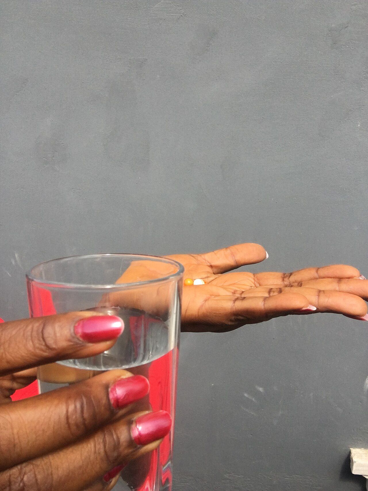 A patient taking a prescribed medication at home reference figure