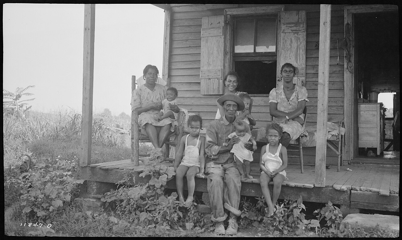 A multigenerational family gathered together on a porch